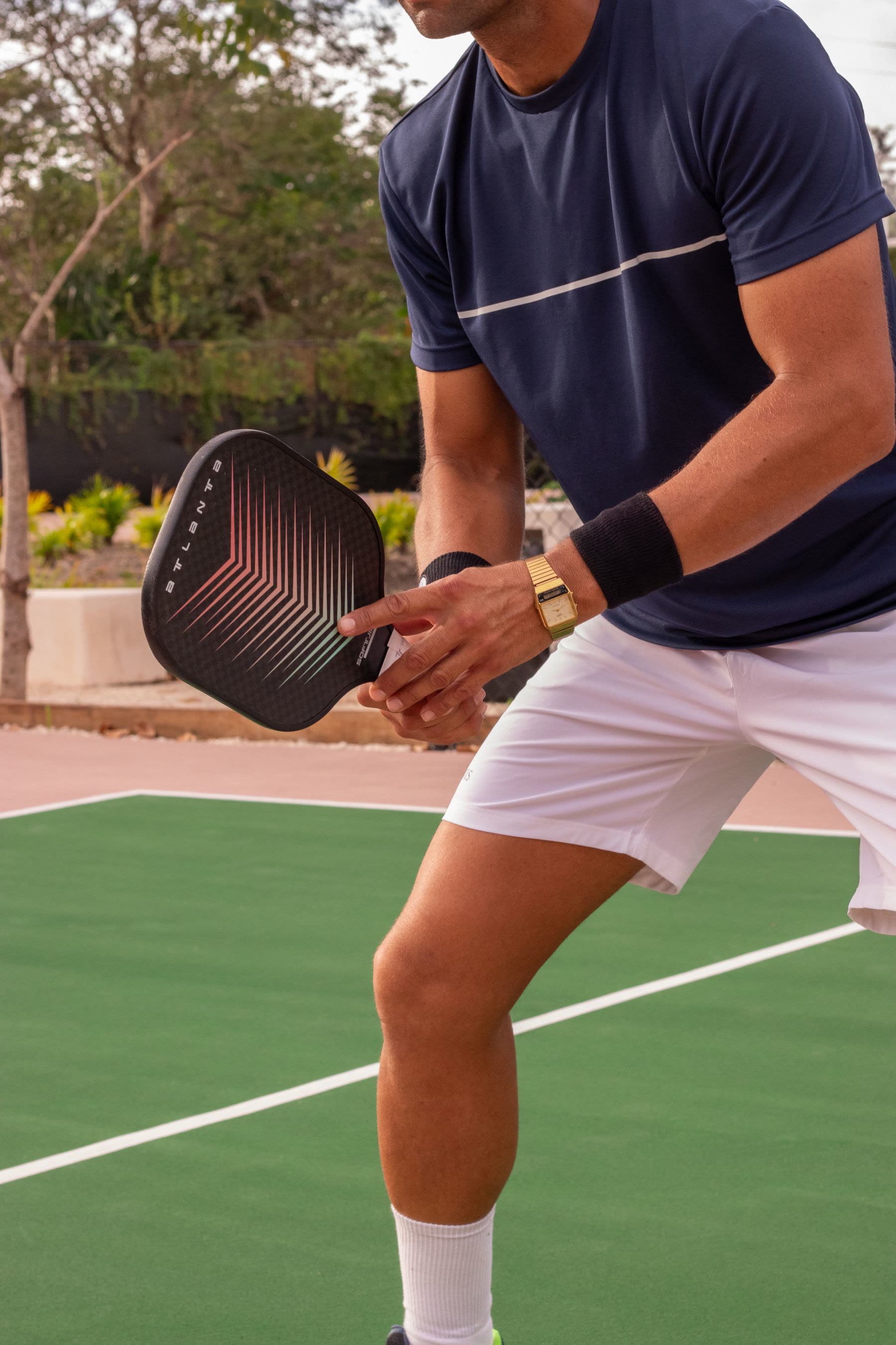 Pickleball paddle and ball on the court